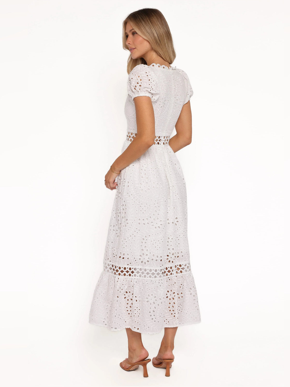 White midi formal dress with open back, scalloped lace trim, and eyelet texture