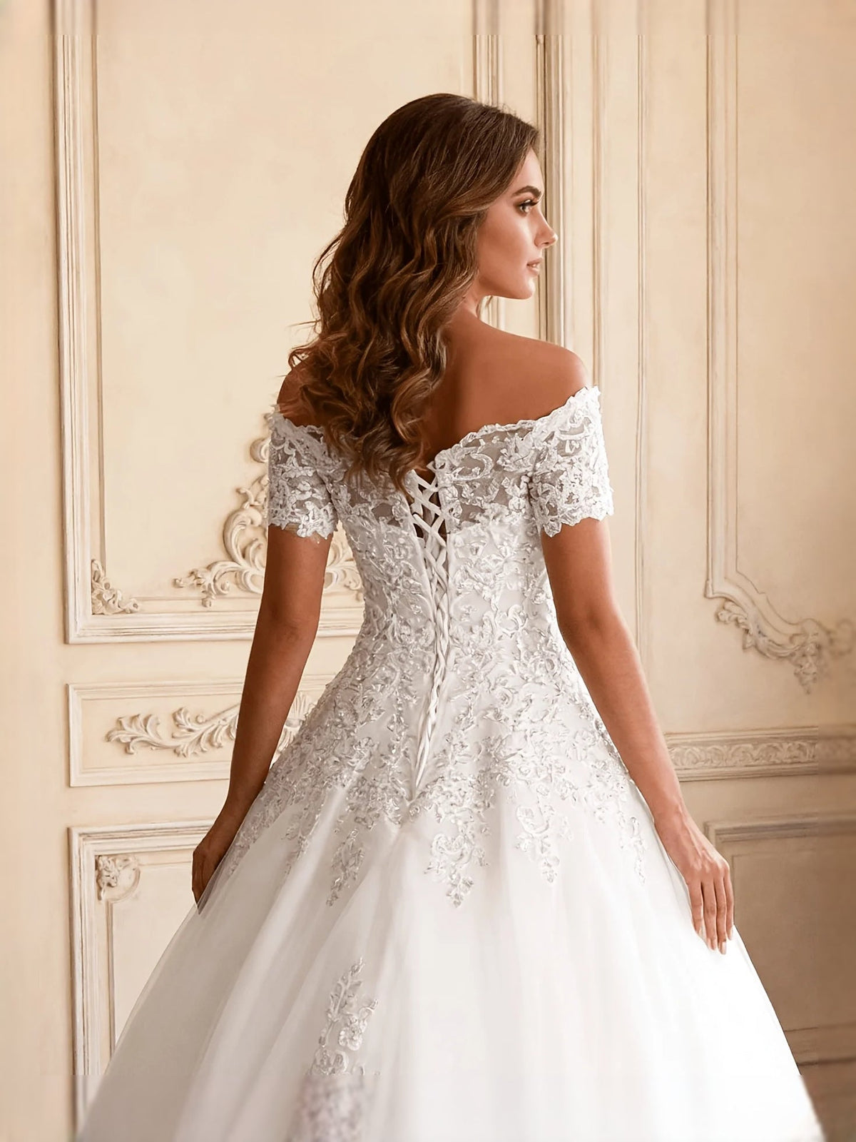 Ivory off-shoulder lace wedding dress with delicate floral embroidery, back detail