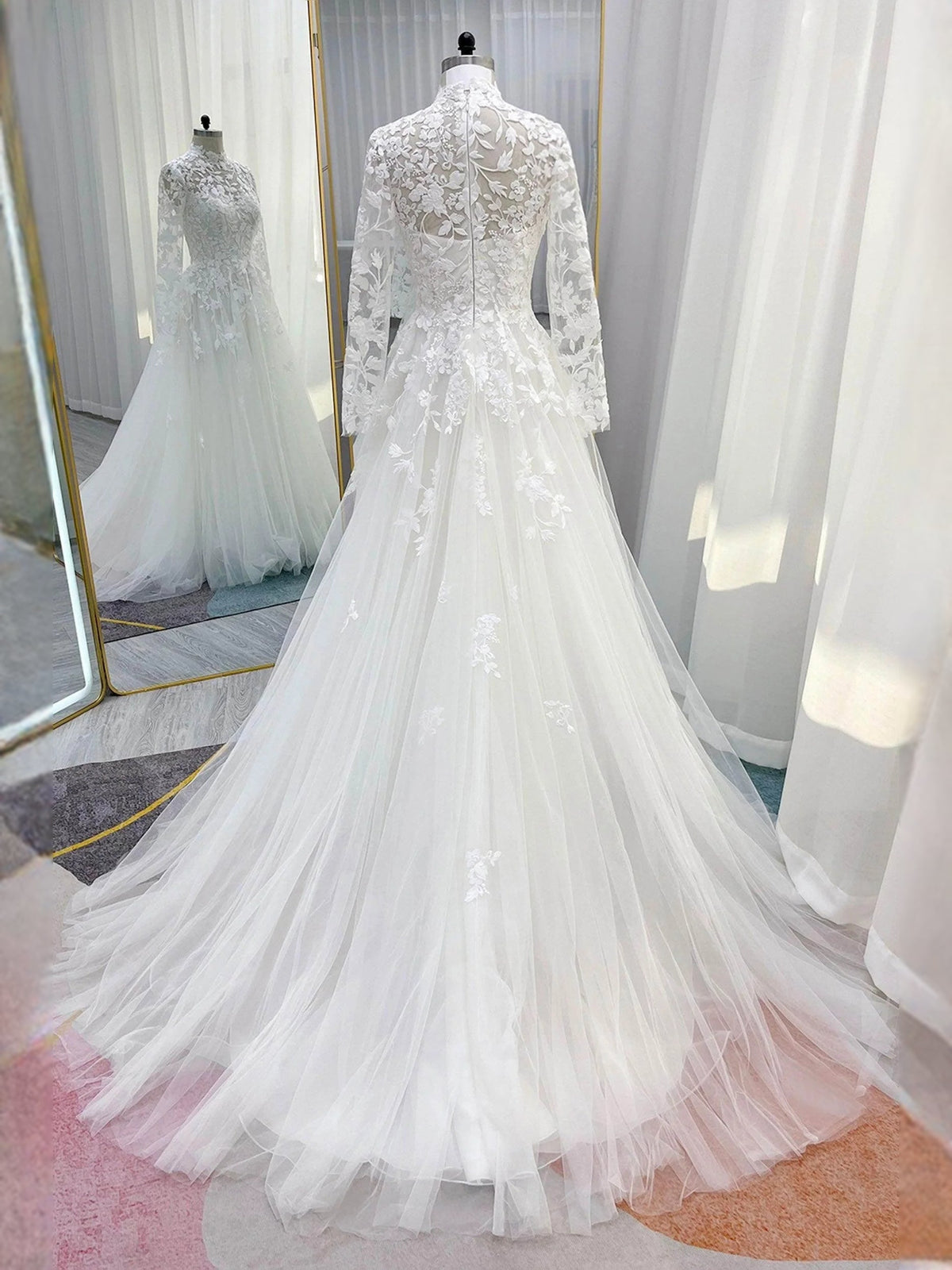 Ivory embroidered high-neck long-sleeve wedding dress with A-line tulle skirt, angled back