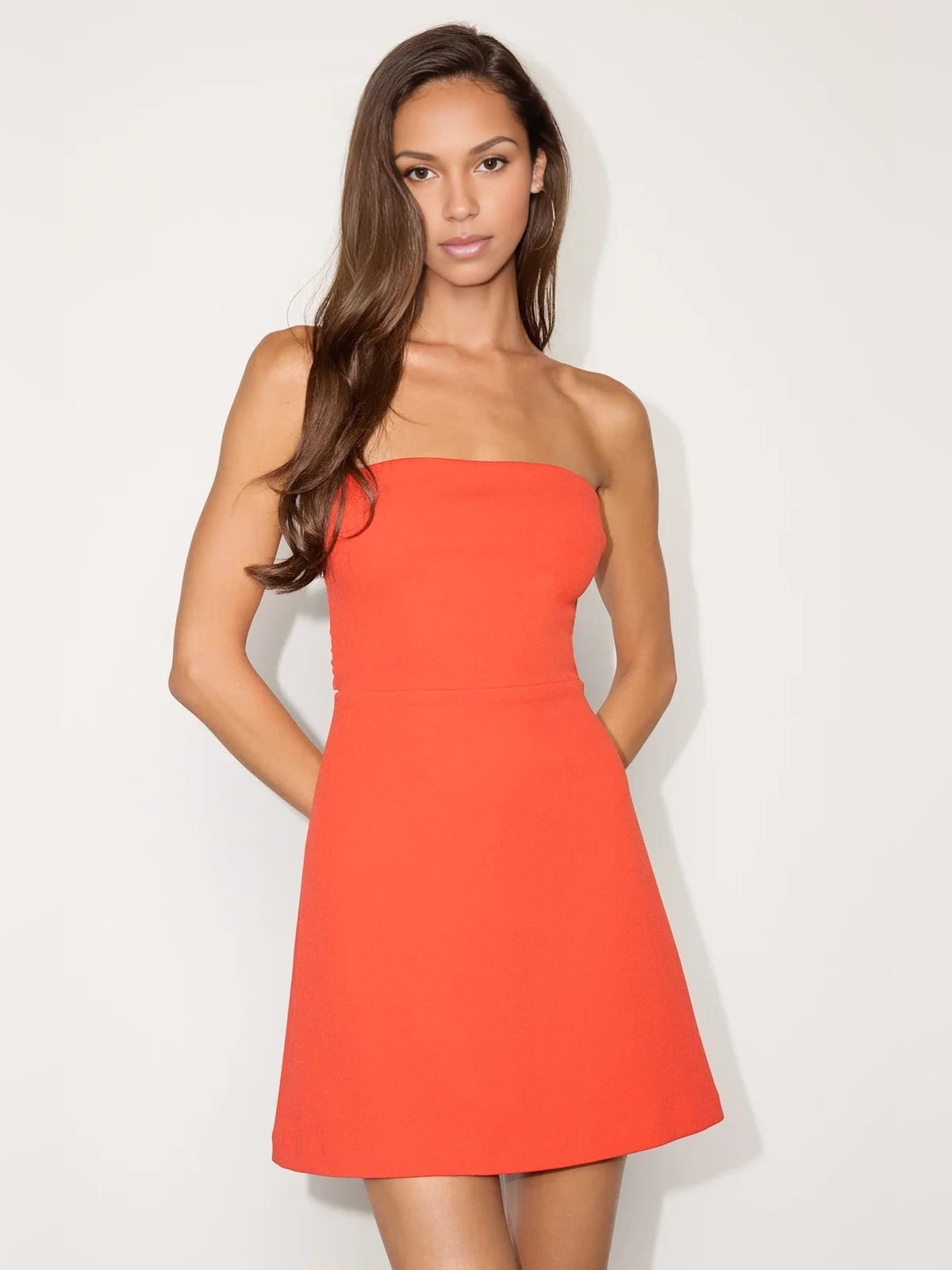 Orange strapless mini dress with ruched bodice and A-line skirt