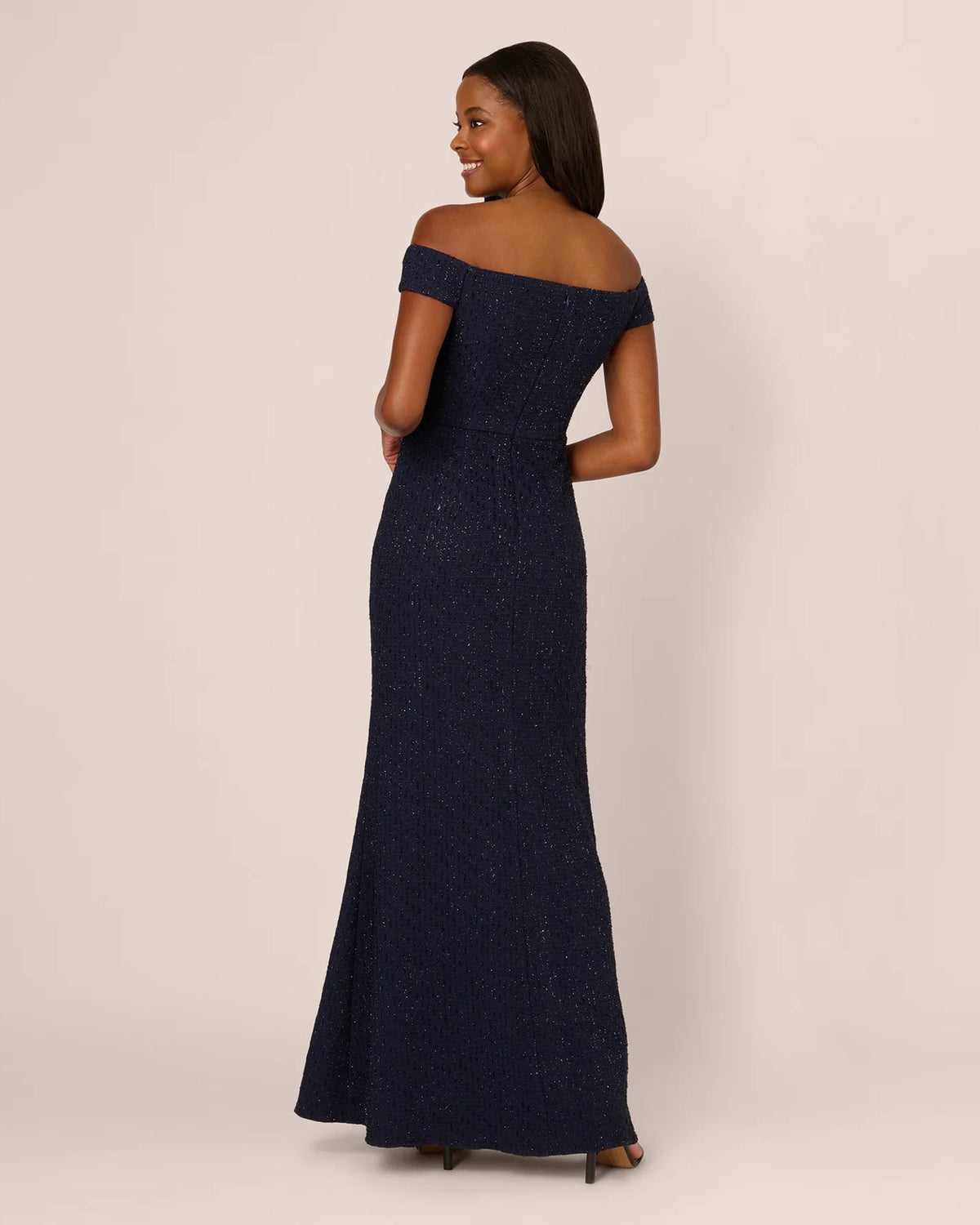 Navy off-shoulder maxi dress with fitted bodice and sparkly textured finish