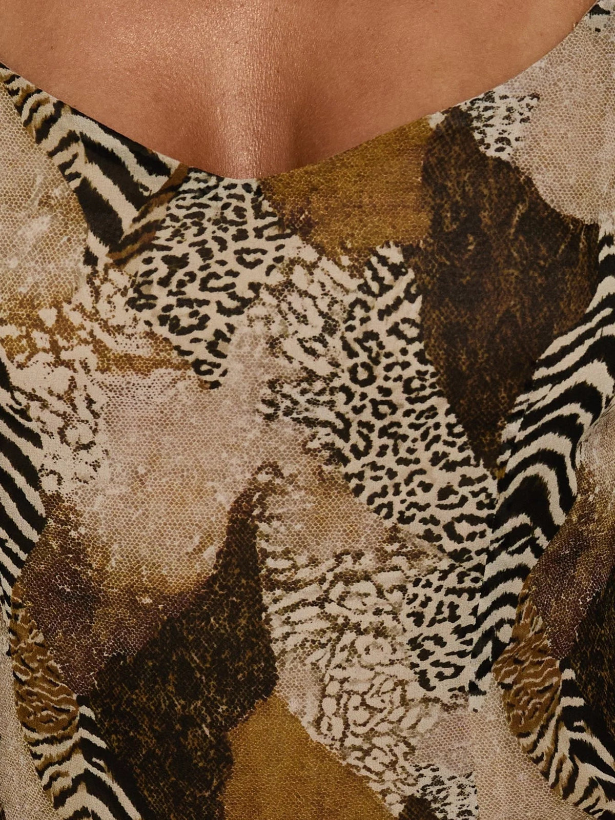 Close-up of snake-print midi dress neckline and spaghetti straps