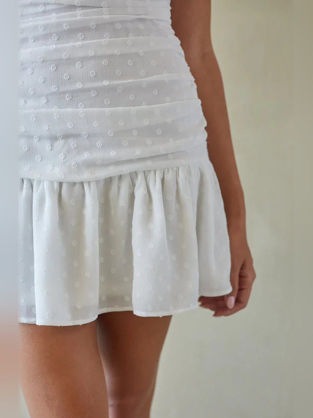 White textured ruched bodice with tiered ruffle mini skirt