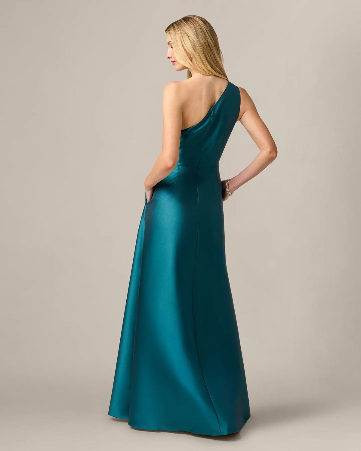 Teal one-shoulder A-line maxi dress from back view with smooth draped seams.