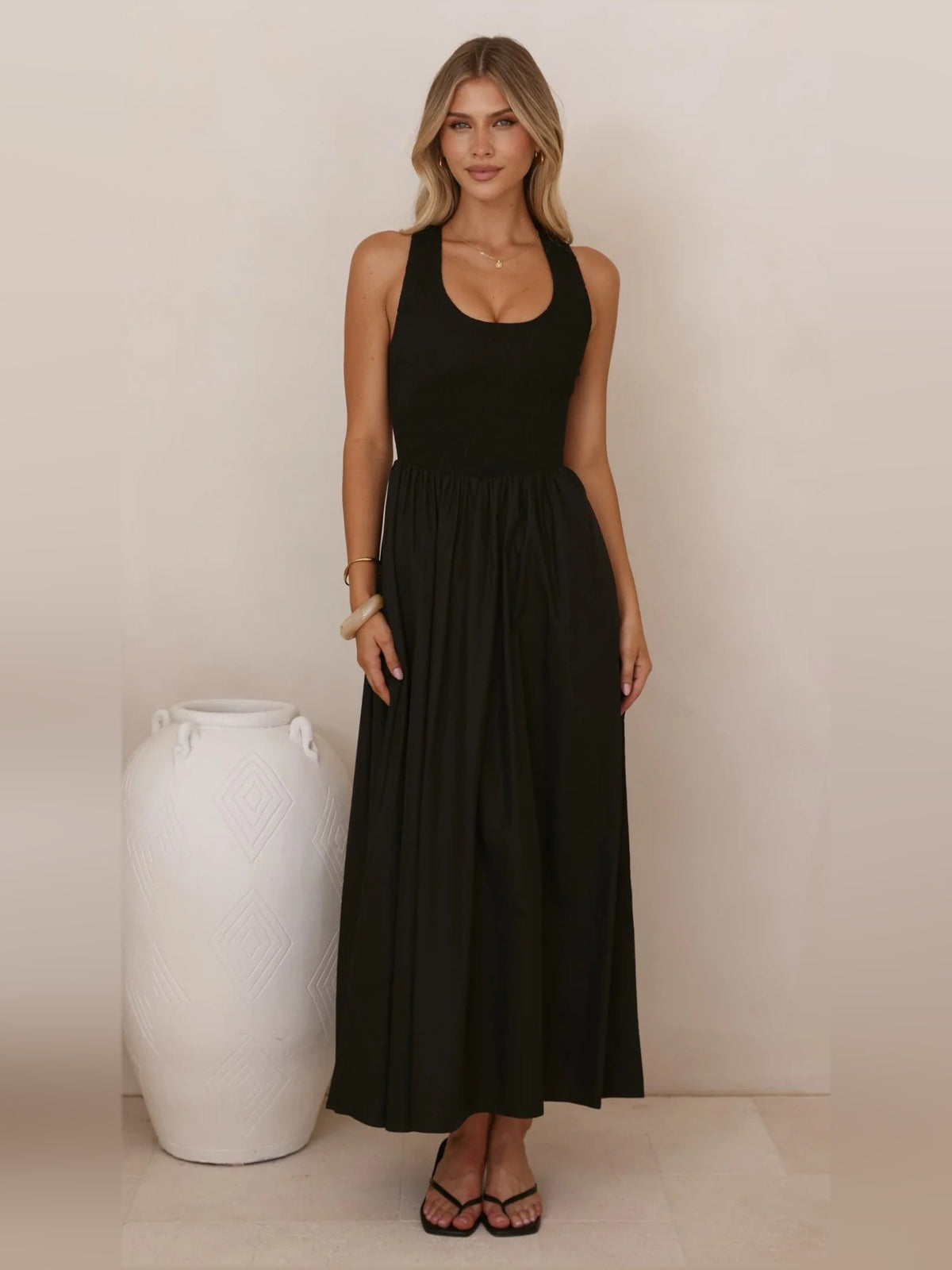 Black a-line maxi formal dress with halter neckline, alternate view showing the skirt
