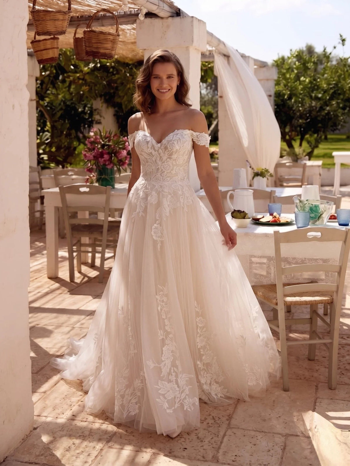 Ivory off-shoulder A-line wedding dress with floral lace embroidery and long tulle skirt