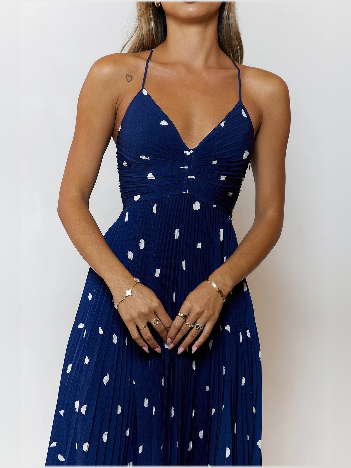 Navy midi dress bodice with white dot print, V-neckline and spaghetti straps
