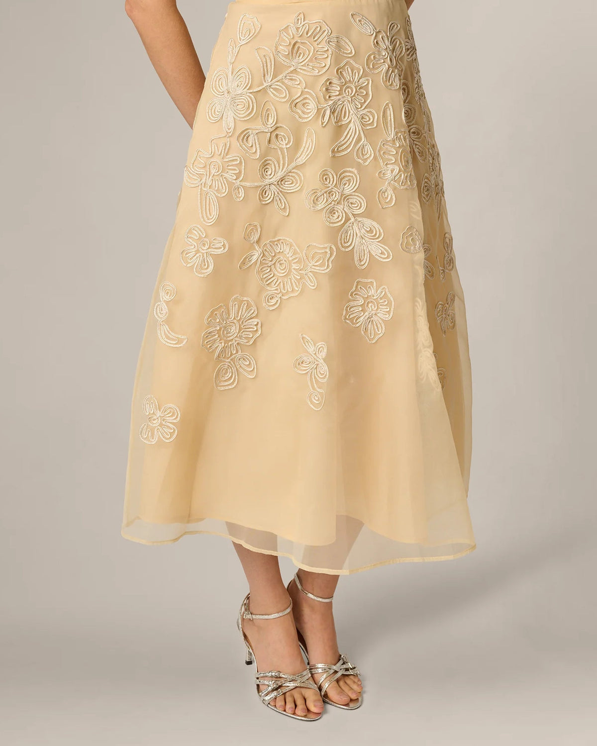 Pale yellow midi A-line dress with embroidered floral motifs and flowing skirt