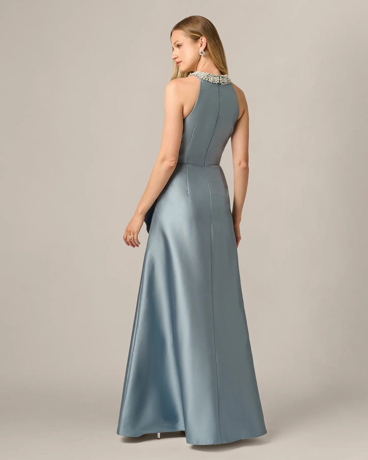 Ice blue halter maxi dress with structured waist seams and flowing skirt