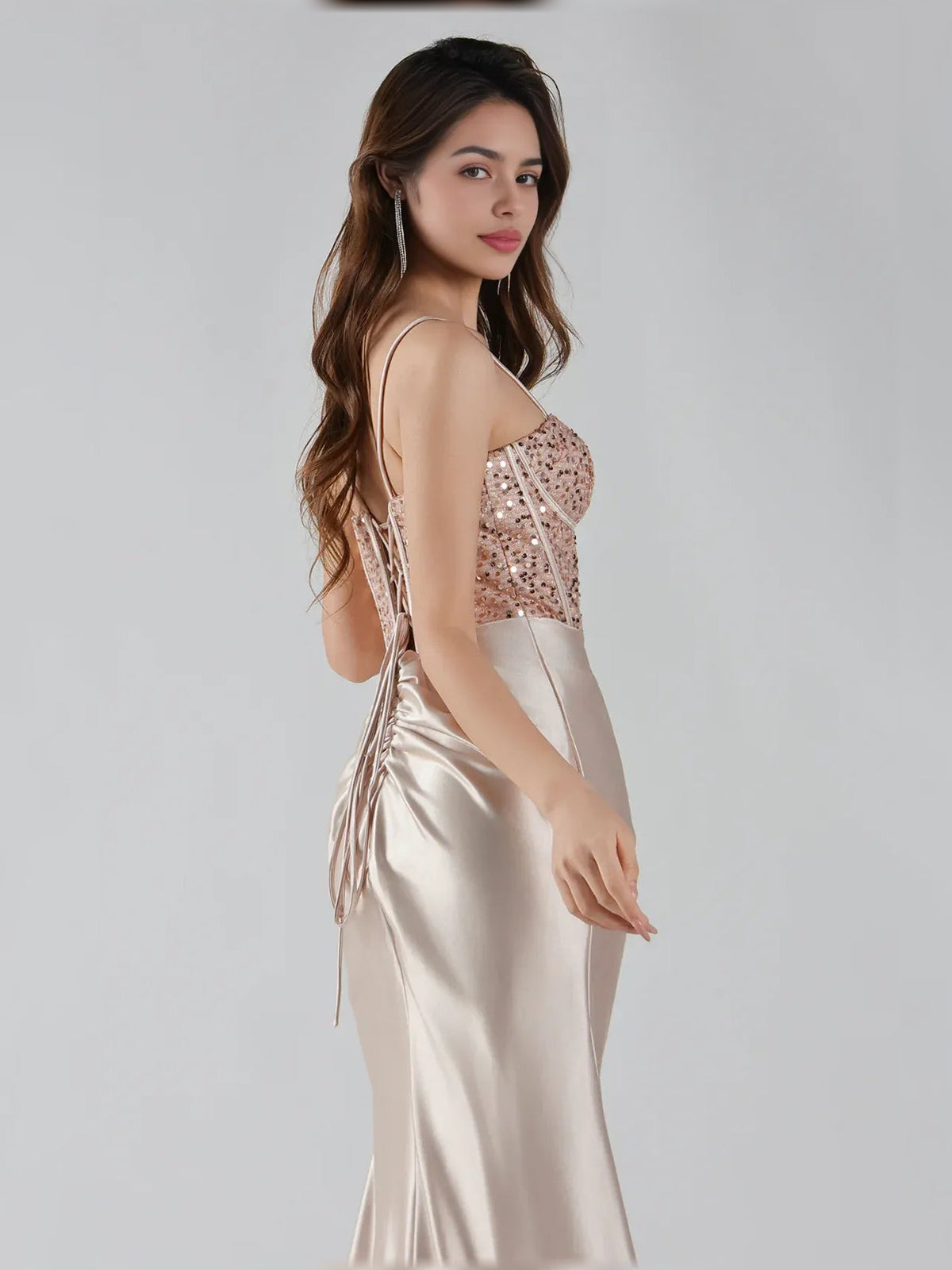 Champagne satin corset gown, side view with beaded bodice and ruched waist drawstrings
