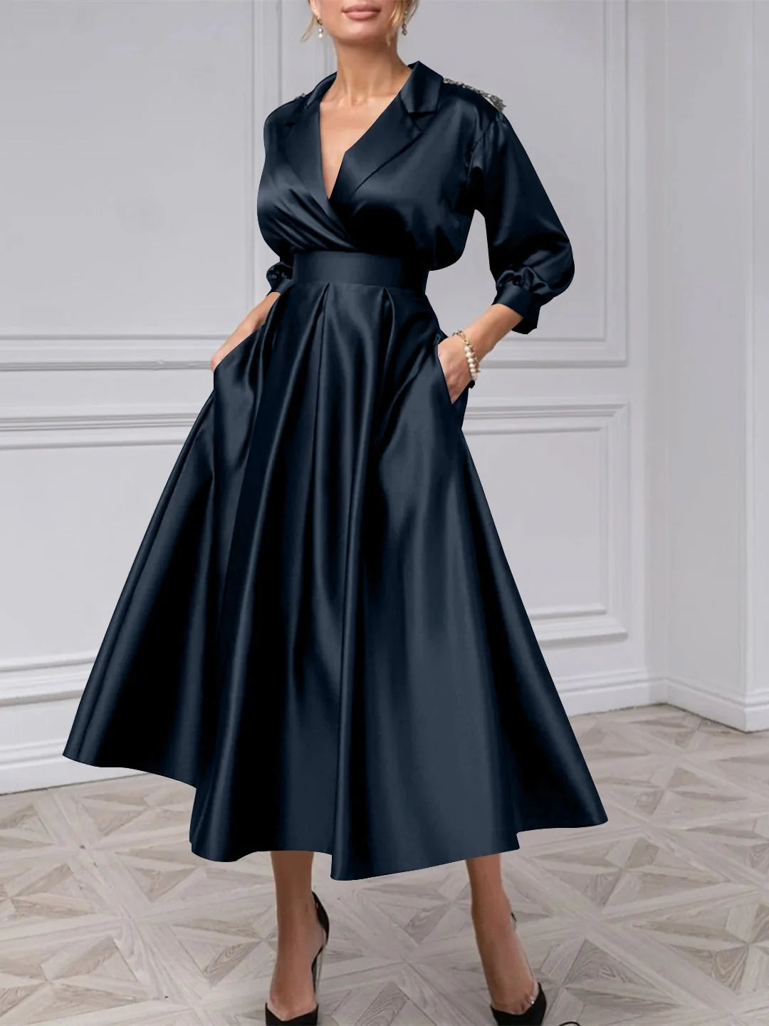 Dark blue satin midi dress with V-neck and long puff sleeves, pleated A-line skirt