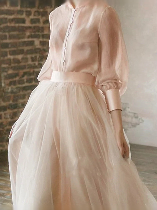 Champagne chiffon maxi dress with high neck, button placket, and puff sleeves
