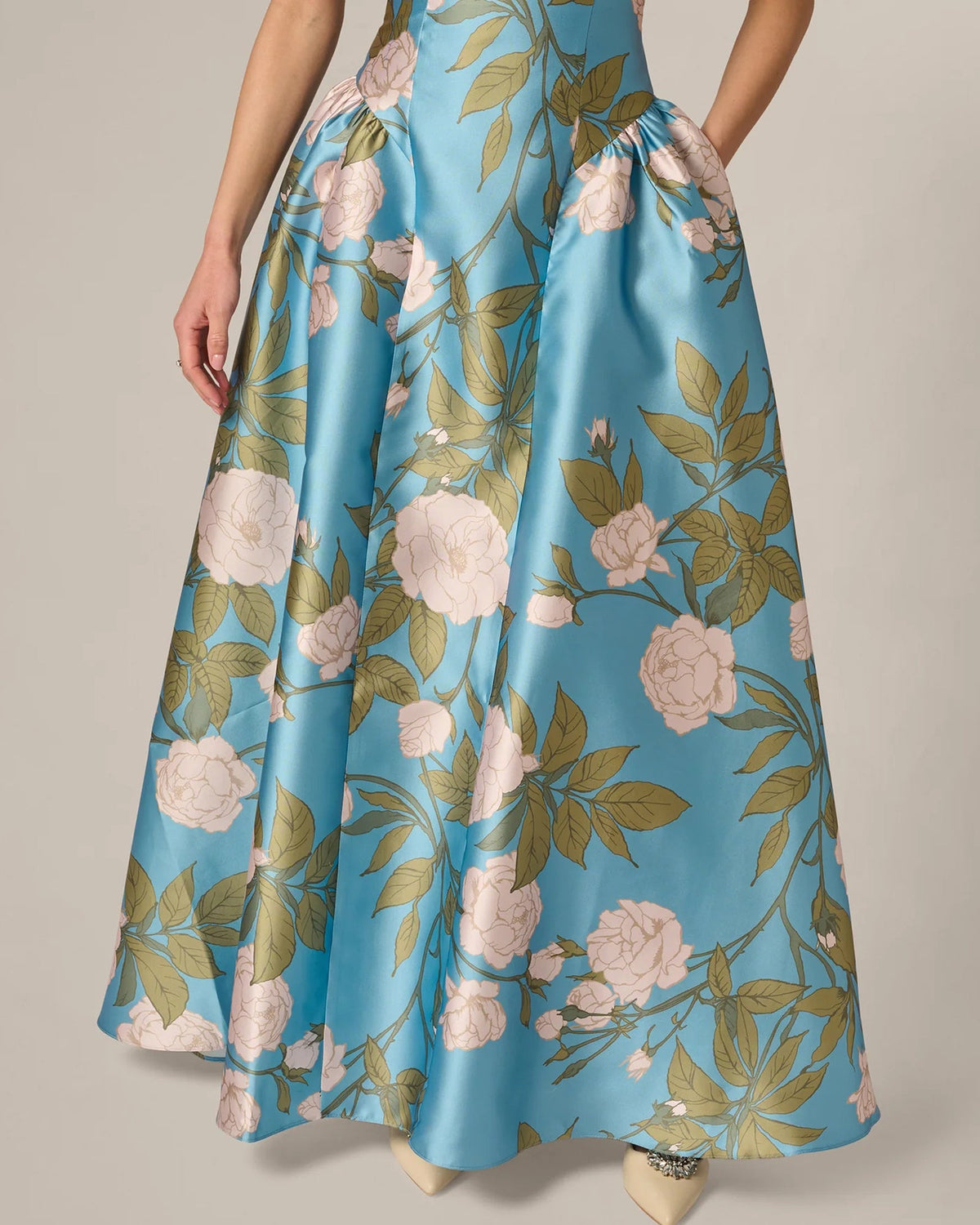Blue floral print maxi skirt with gathered accents and flowing A-line shape