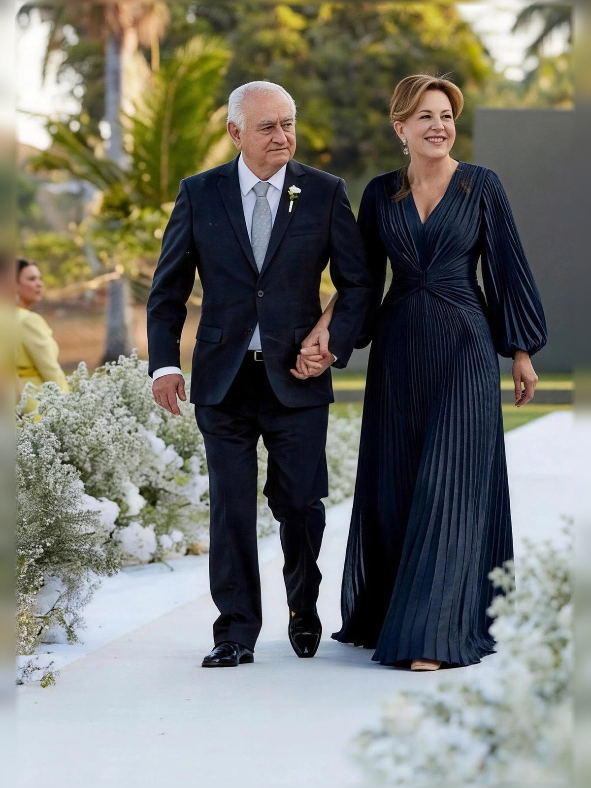 Navy pleated A-line V-neck maxi dress with ruched bodice and long flared sleeves