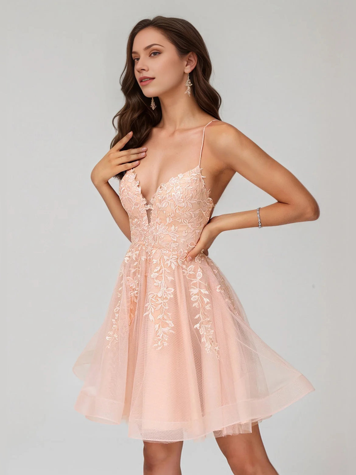 Pearl pink A-line mini dress with V-neck, spaghetti straps, and floral appliqué