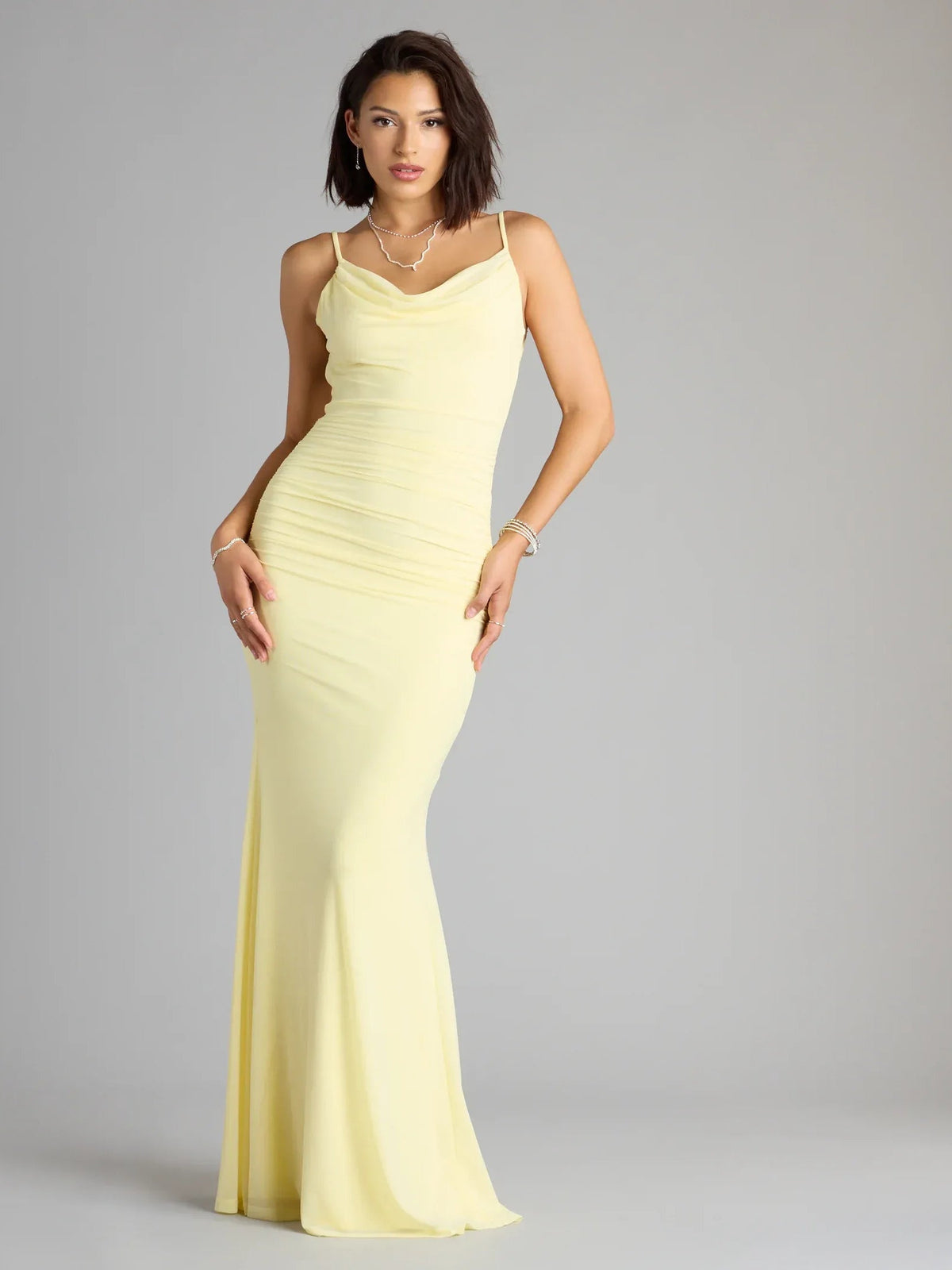 Yellow cowl-neck formal gown with ruched bodice, spaghetti straps, floor-length