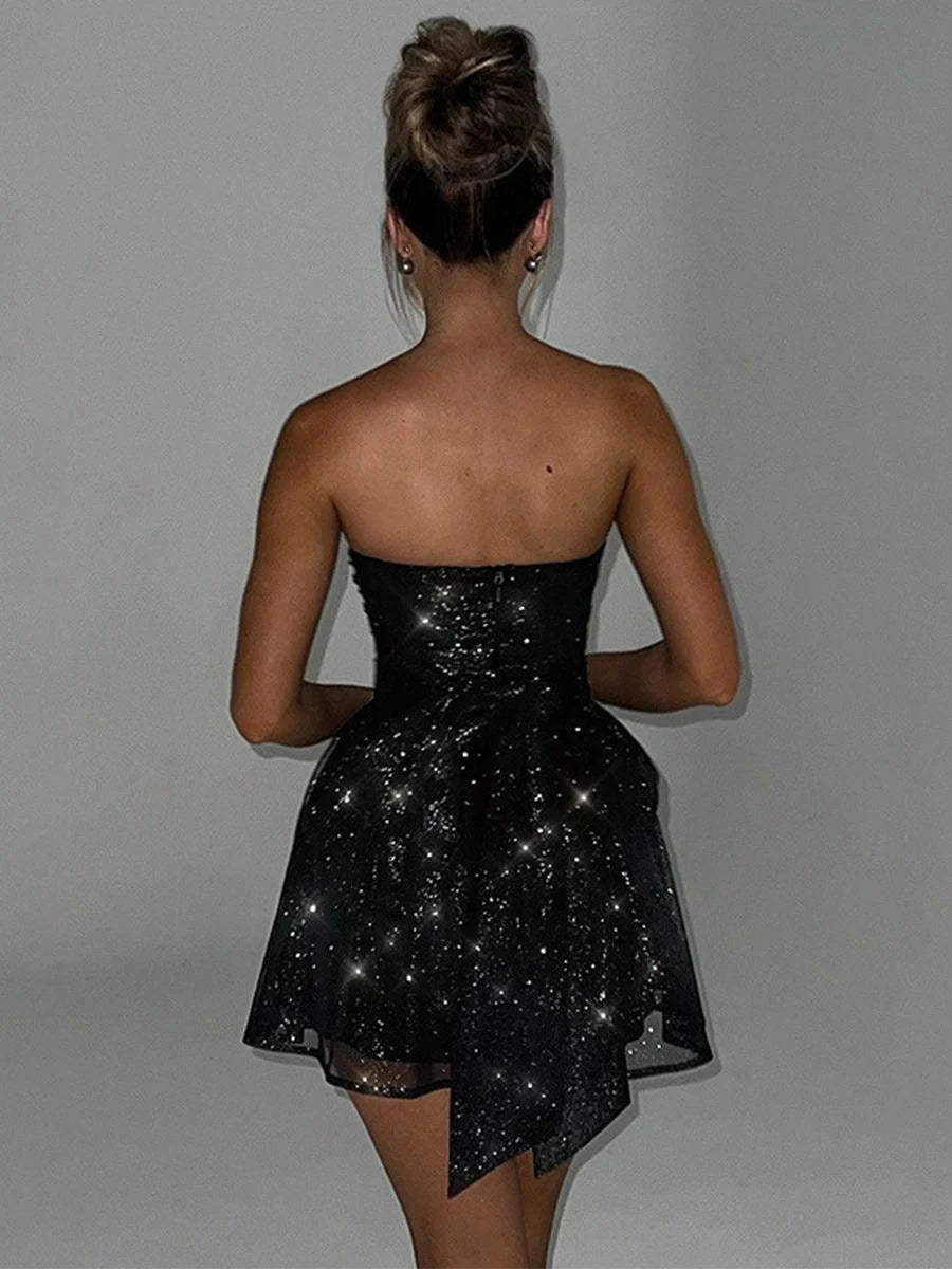 Black strapless corset mini homecoming dress with sparkly A-line skirt, back view