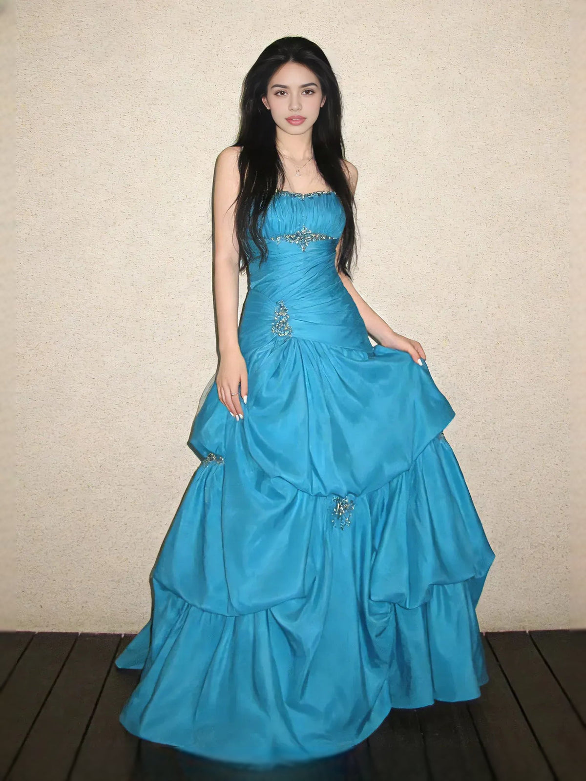 Teal blue strapless satin maxi prom dress with sweetheart neckline, ruched tiers and jeweled accents