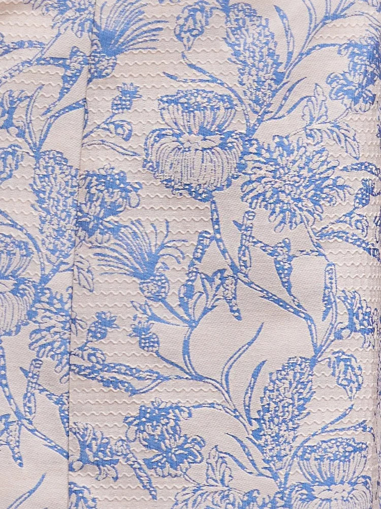 Close-up of light blue floral print fabric for a strapless mini dress