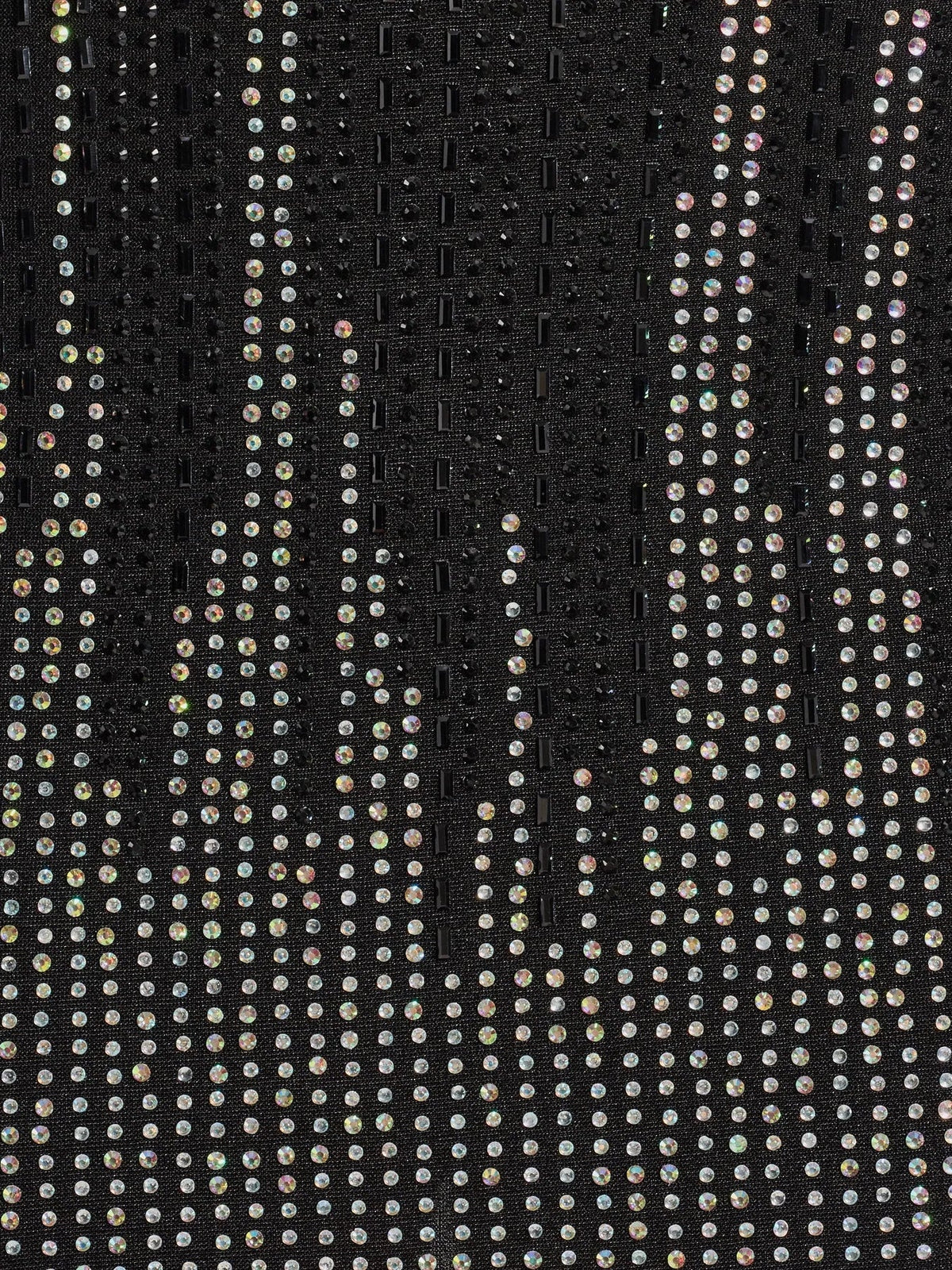 Close-up of black rhinestone mesh fabric with sparkling light-reflecting dots