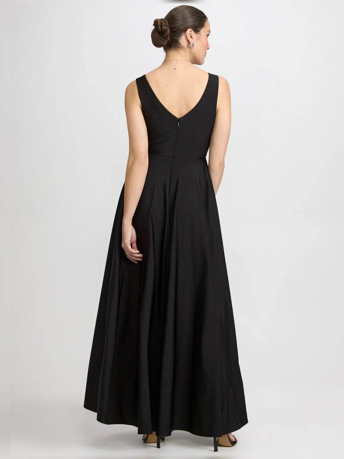Black V-neck ruched floor-length formal dress, sleeveless back view with gathered skirt