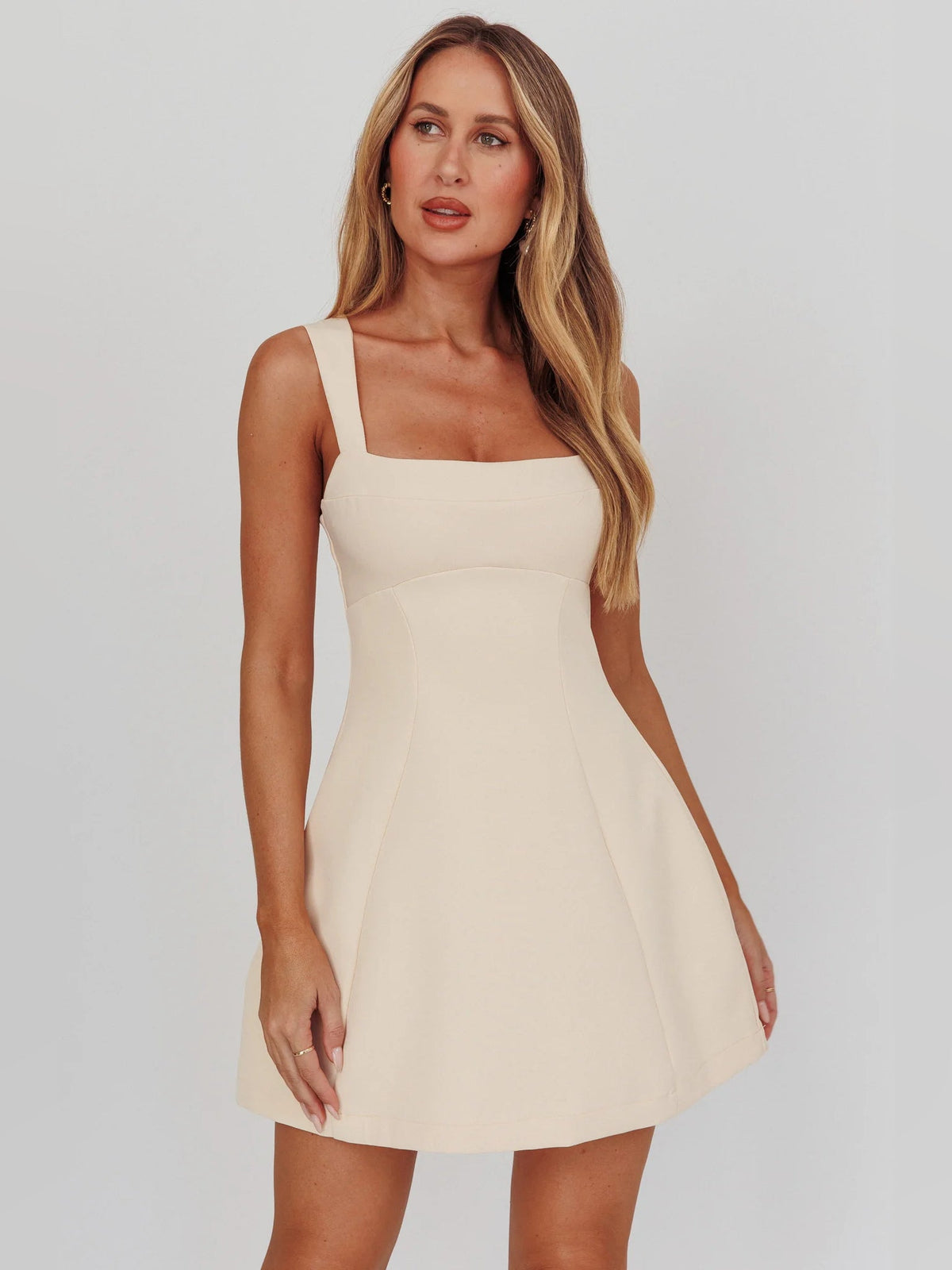 Front view apricot A-line mini homecoming dress with square neckline and straps