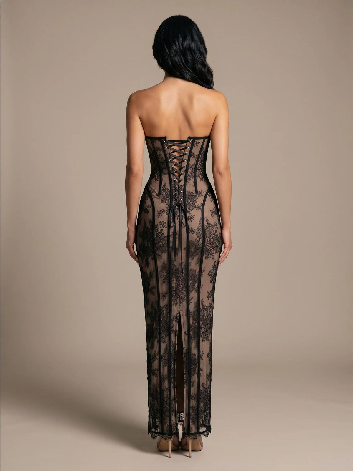Black open-back corset mermaid gown with sheer lace and front slit, floor length