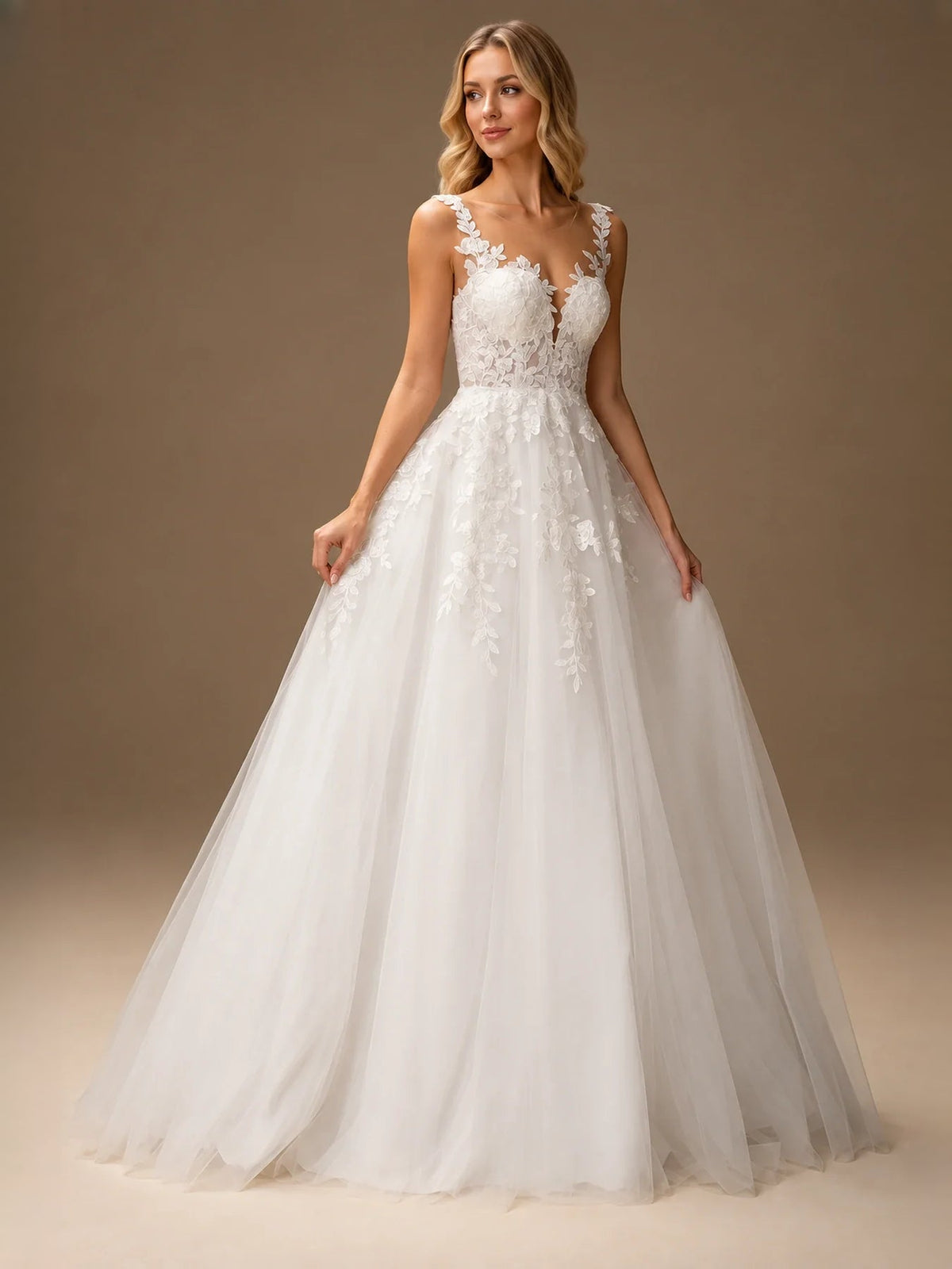 Ivory sleeveless A-line wedding dress with lace floral bodice and flowing tulle