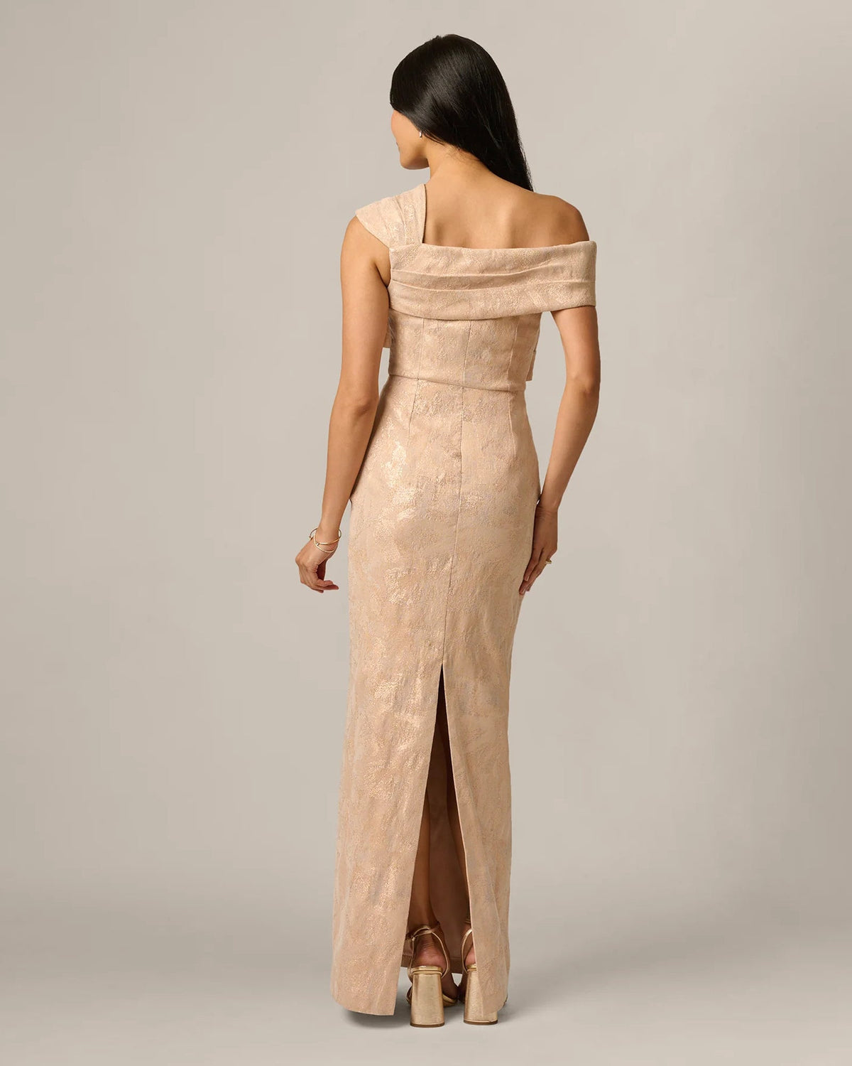 Champagne shimmer sheath maxi dress from back with off-shoulder drape