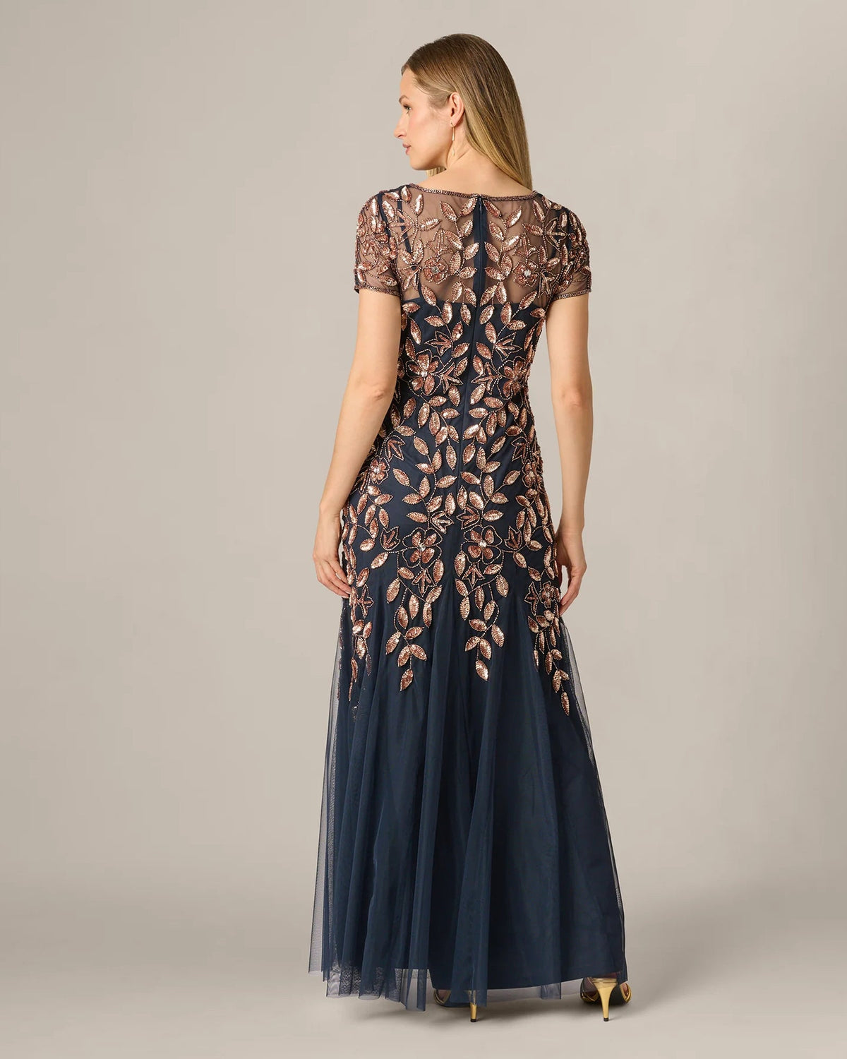 Navy A-line maxi dress back view with short sleeves and rose-gold floral embroidery
