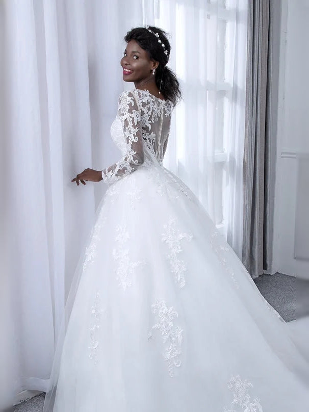 Ivory A-line tulle wedding dress with floral lace bodice and sheer long sleeves, full skirt