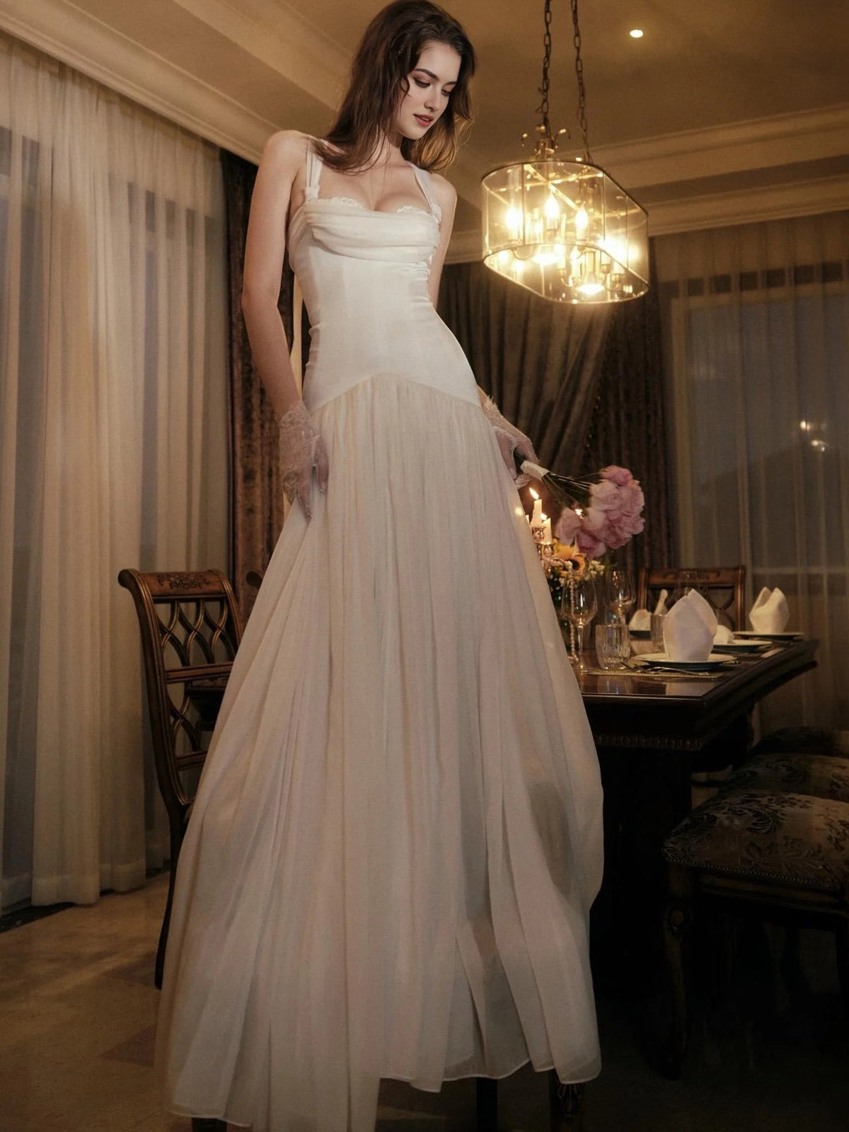 Ivory A-line wedding dress with square neckline and flowing skirt, holding pink bouquet