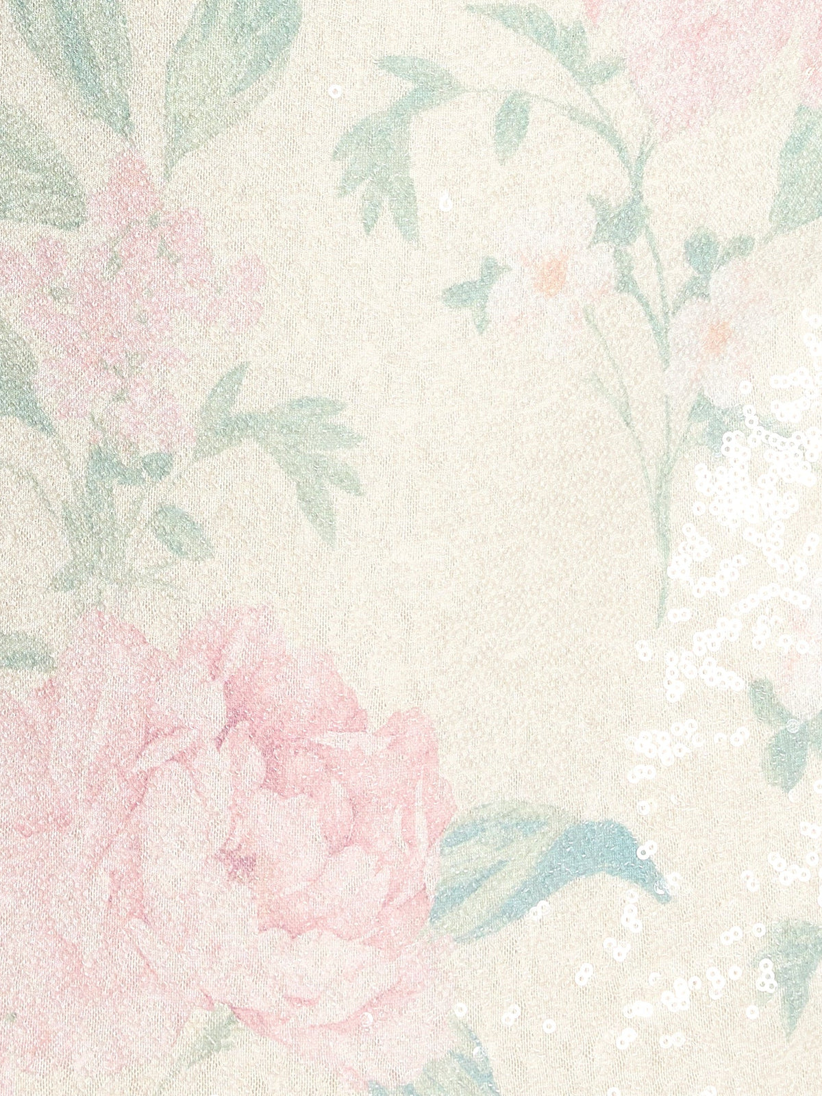 Floral sequin fabric swatch in pastel pink and blue with leaf pattern