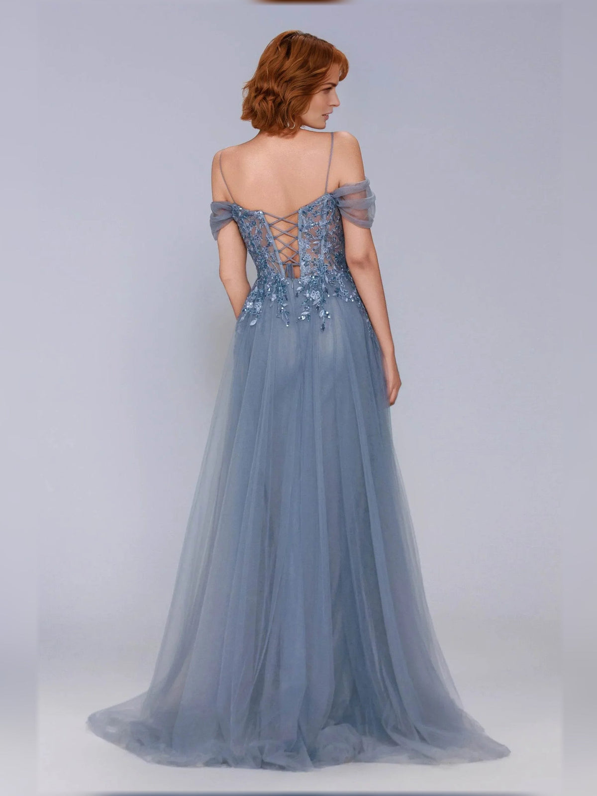 Dusty blue off-shoulder corset gown with crisscross lace-up back and flowing tulle skirt
