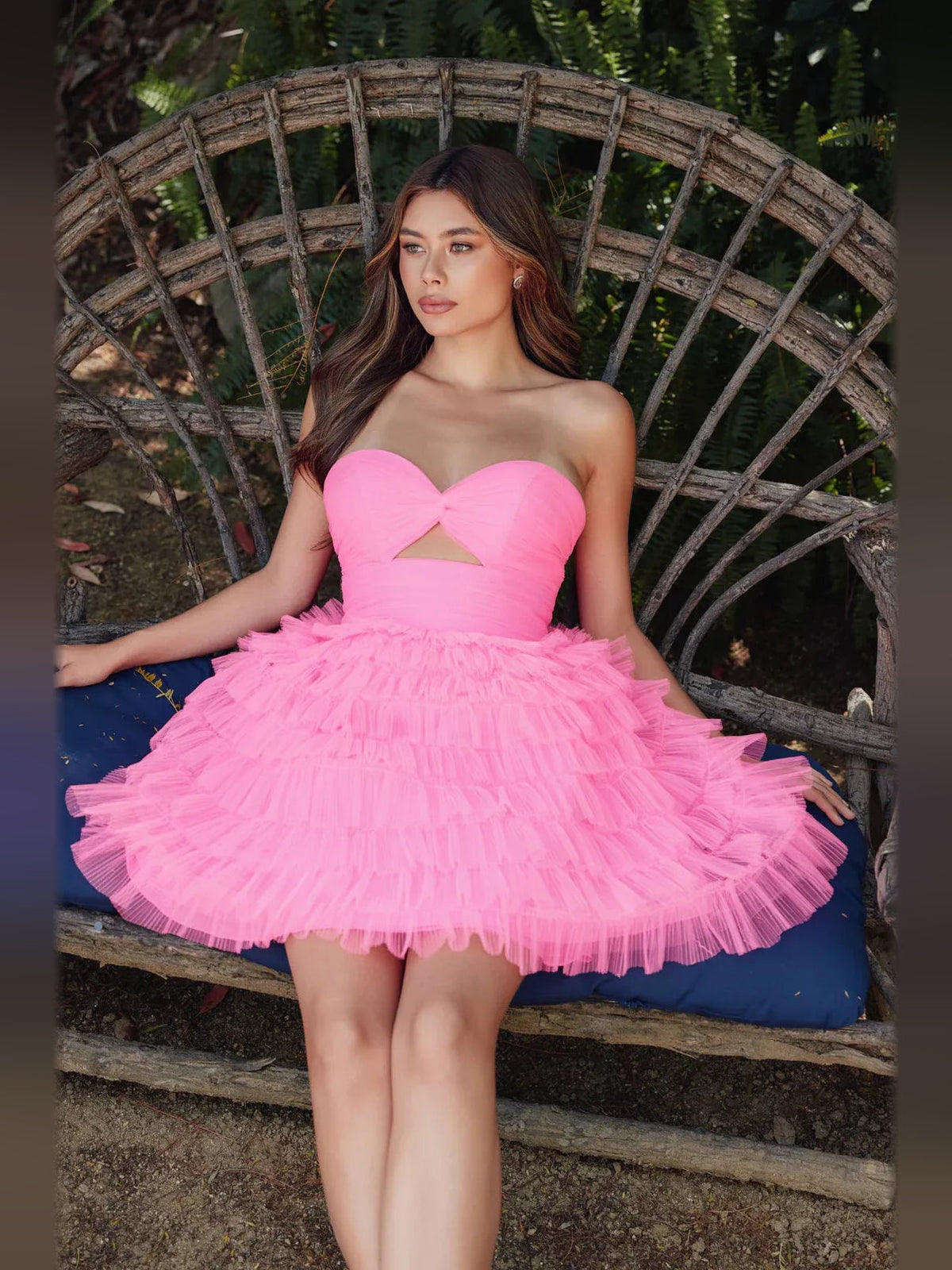Pink sweetheart mini dress with cut-out bodice and layered ruffled tulle skirt