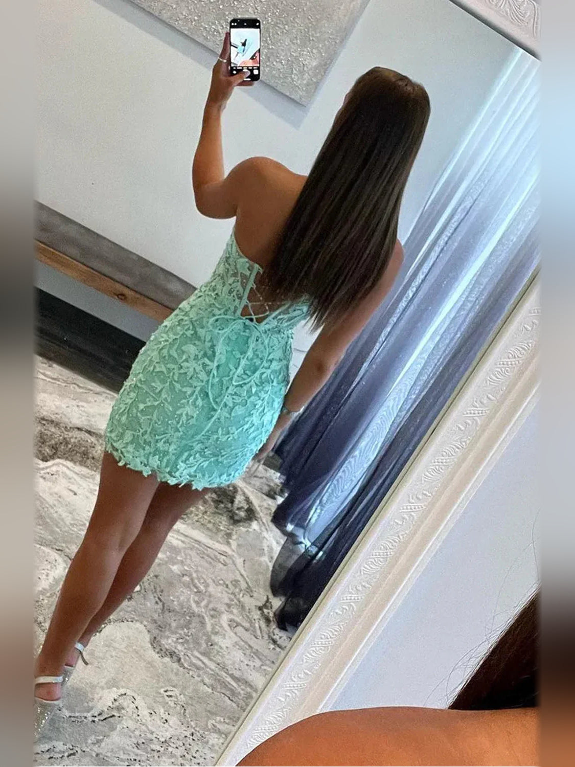 Mint floral lace mini corset dress from back view with crisscross lace-up detail