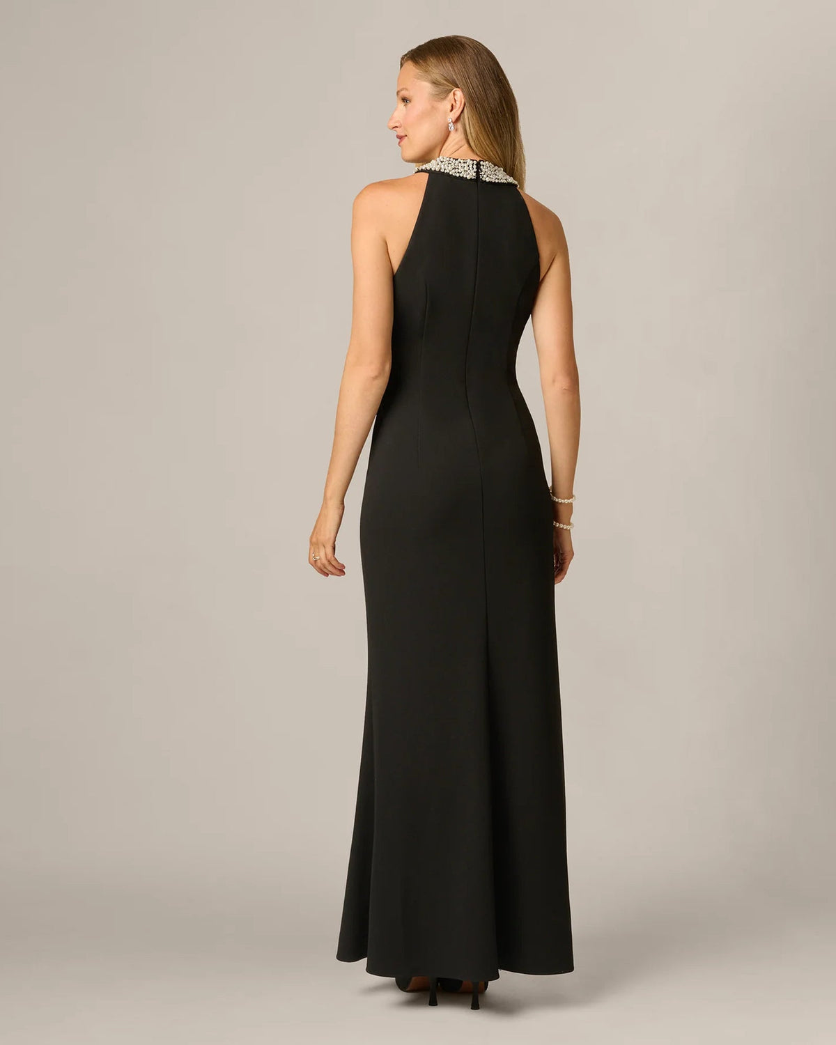 Black halter maxi dress back view with flowing A-line skirt