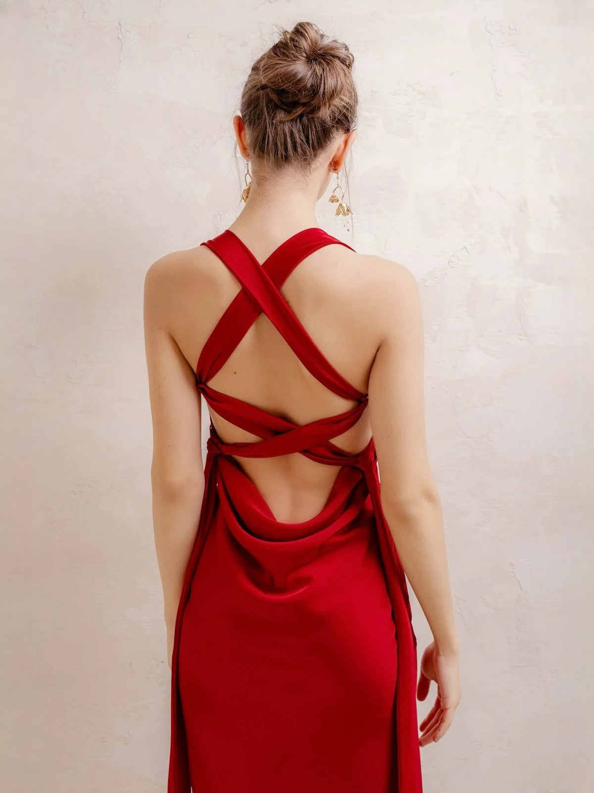 Red satin maxi dress with cowl neckline and crisscross open back straps