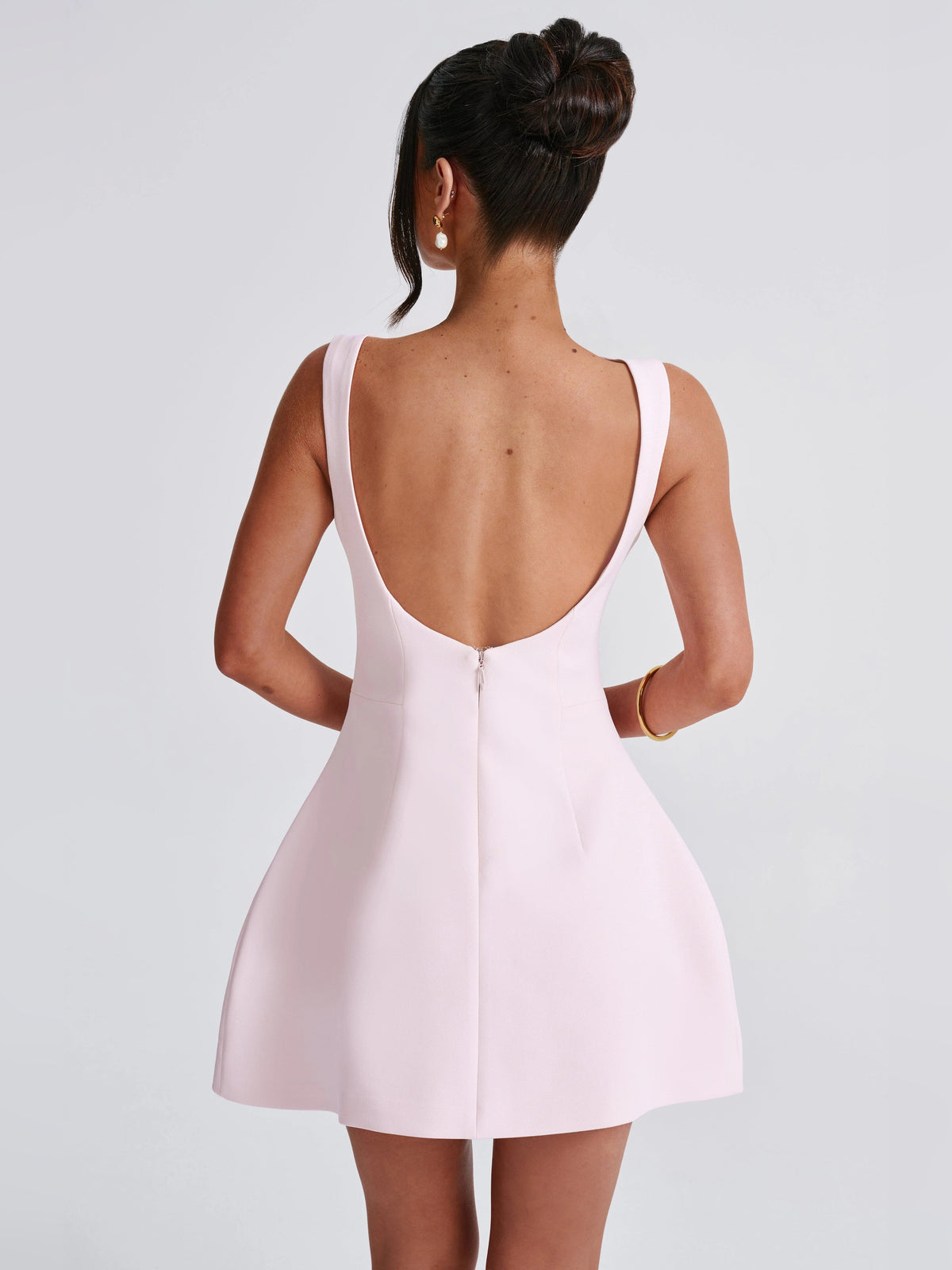 Blush mini sleeveless dress with low open back and A-line silhouette