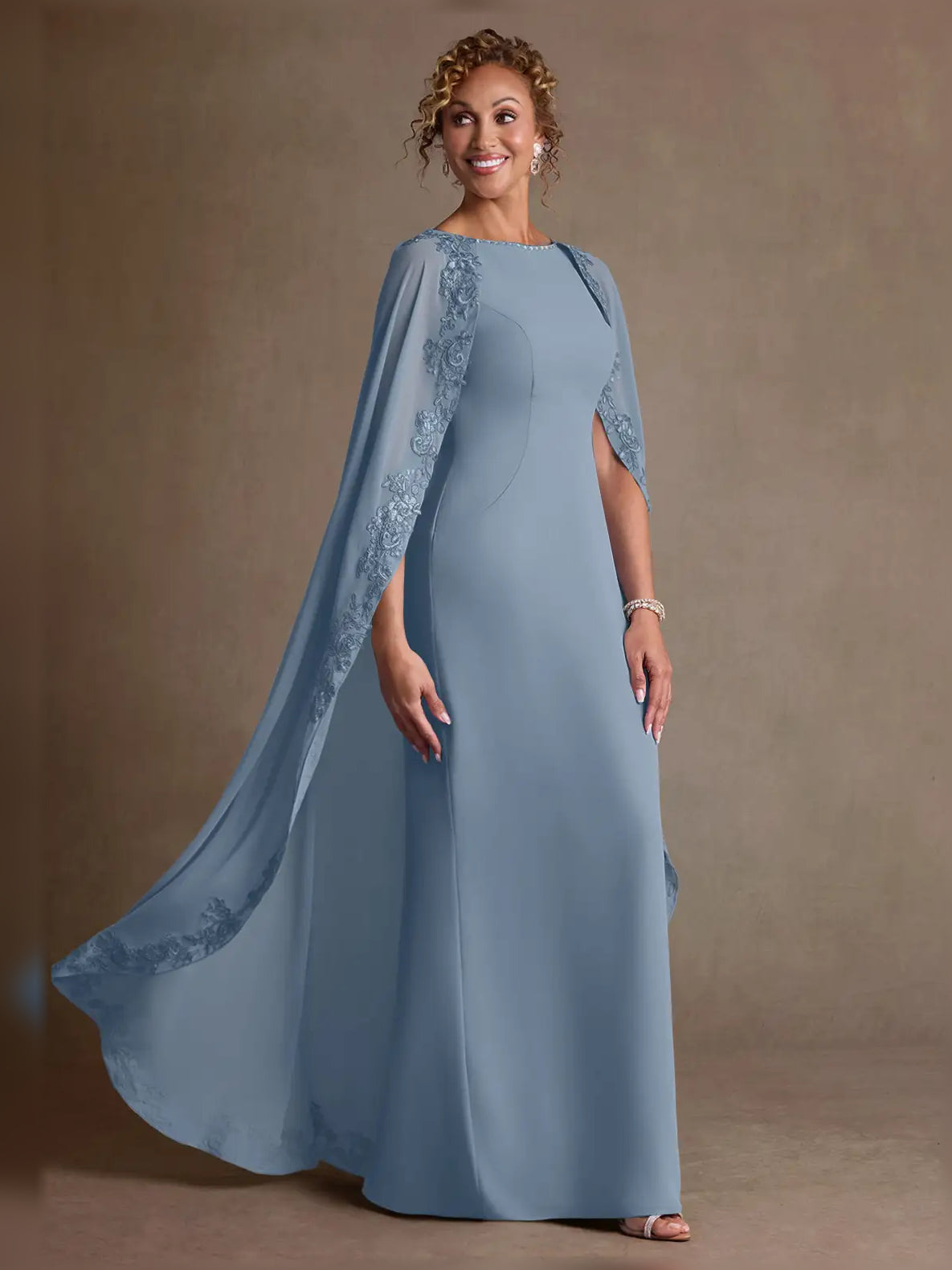 Dusty blue chiffon sheath maxi dress with boat neck and flowing sheer lace cape