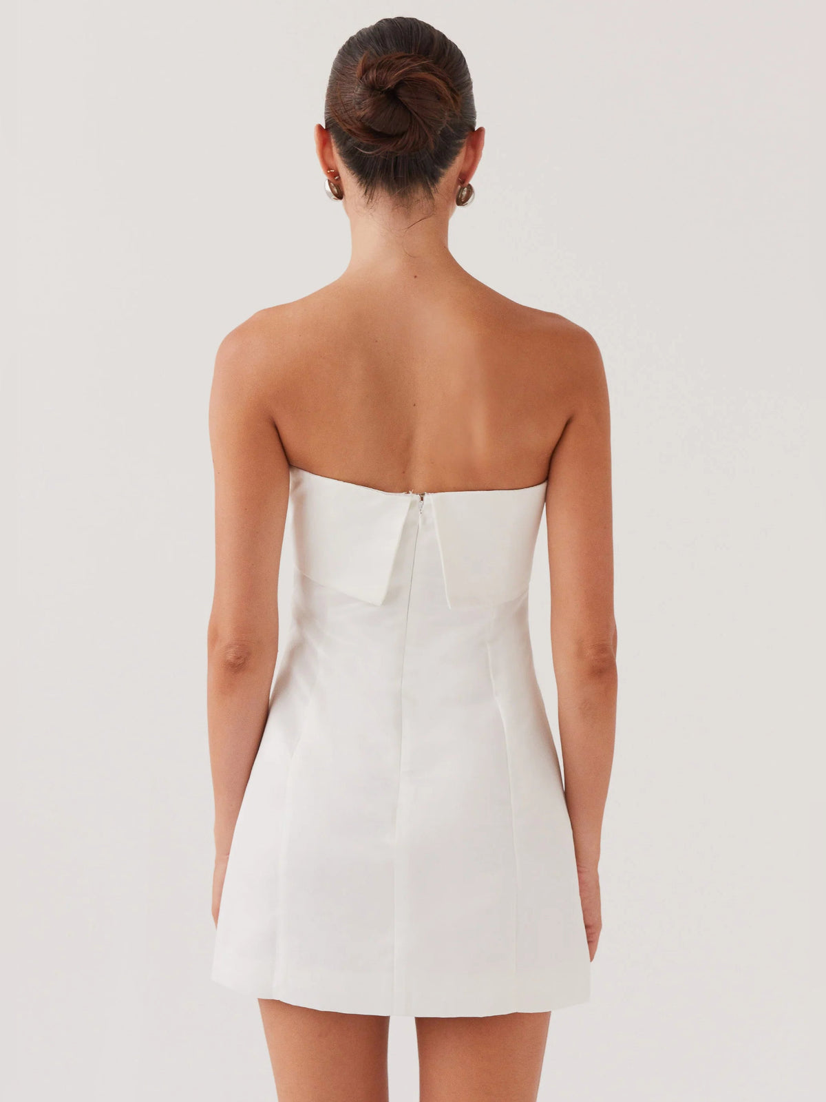 Pearl strapless mini dress, open back view with corset seams and back zipper closure