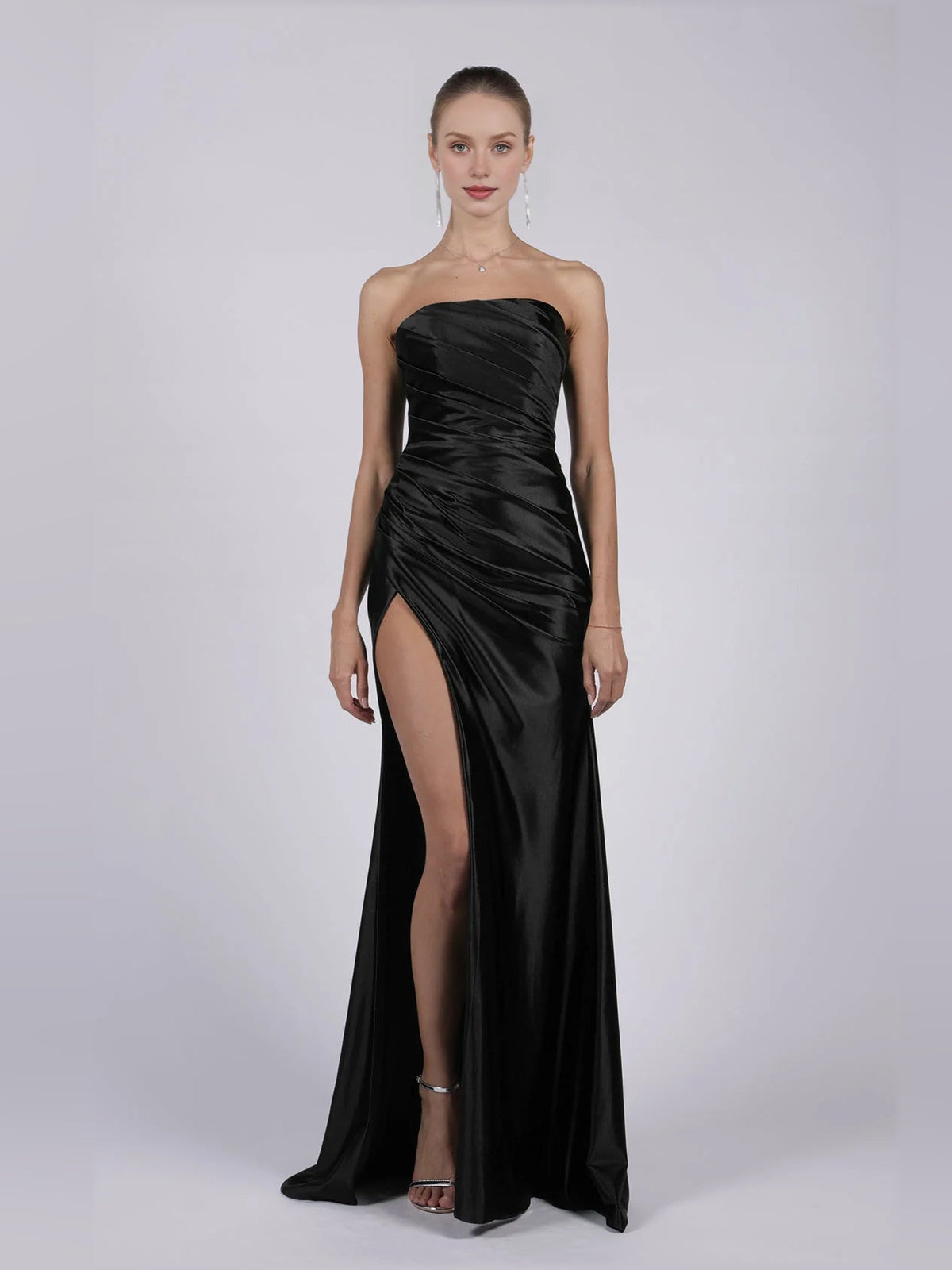 Strapless mermaid formal dress in black with ruched bodice and high thigh slit