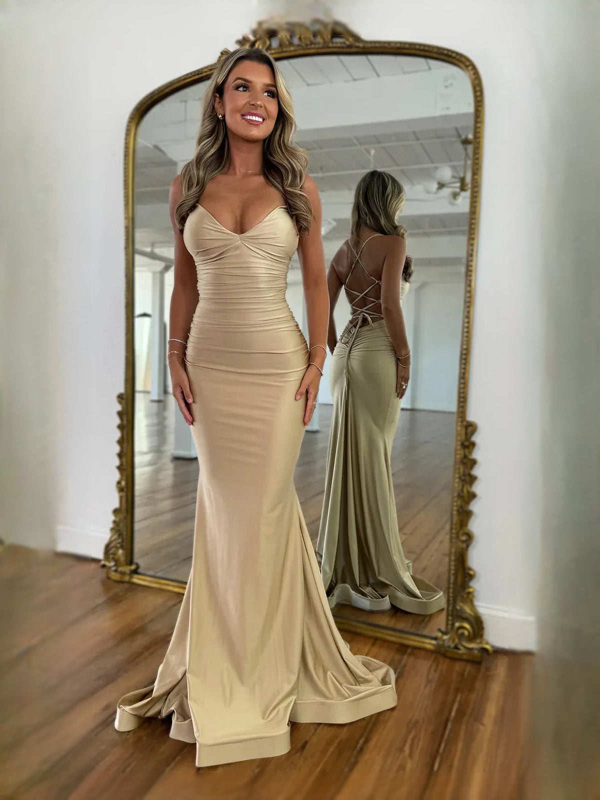 Champagne ruched mermaid prom dress with plunging V-neck and long fitted skirt