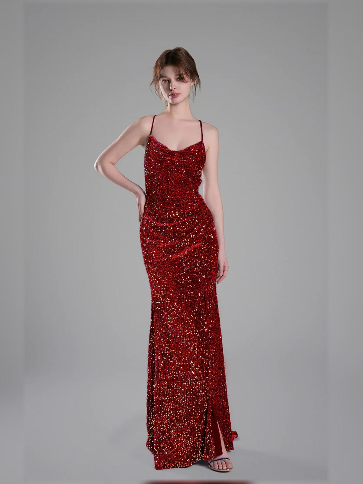 Deep red sequin floor-length formal dress with spaghetti straps and side slit
