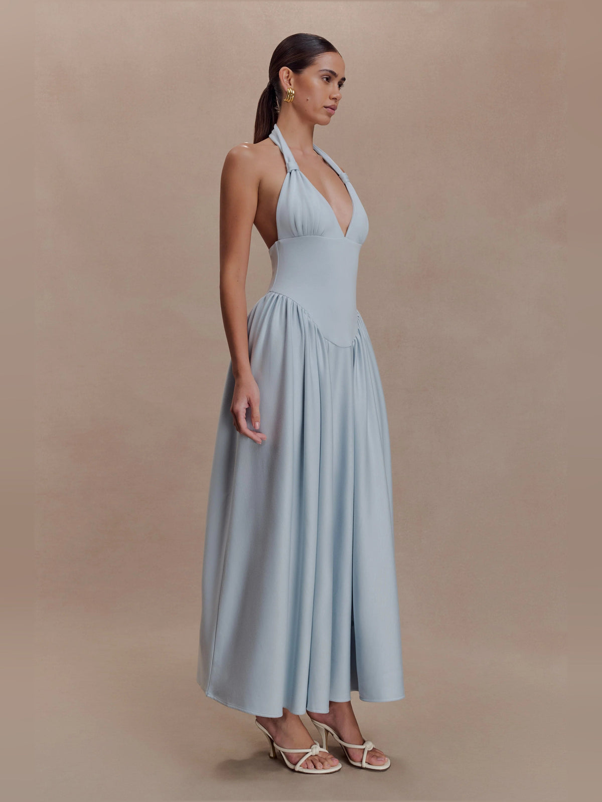 Light blue halter midi formal dress with V-neck bodice and gathered pleated skirt