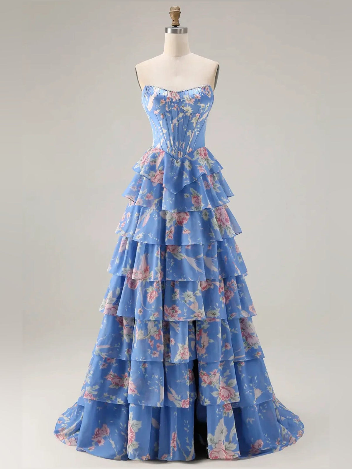 Blue floral tiered ruffle strapless A-line prom dress shown on a mannequin.