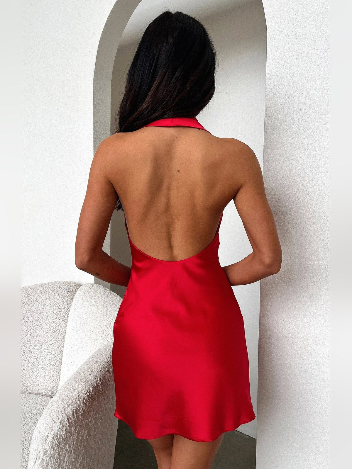 Red backless satin mini dress with draped cowl back and open scoop back
