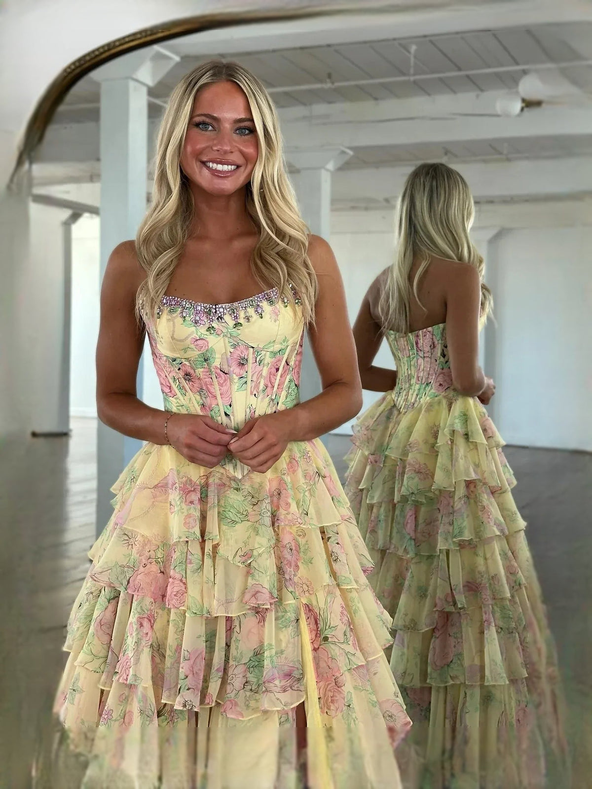 Light pink floral corset-style sweetheart A-line prom dress with tiered ruffles and slit