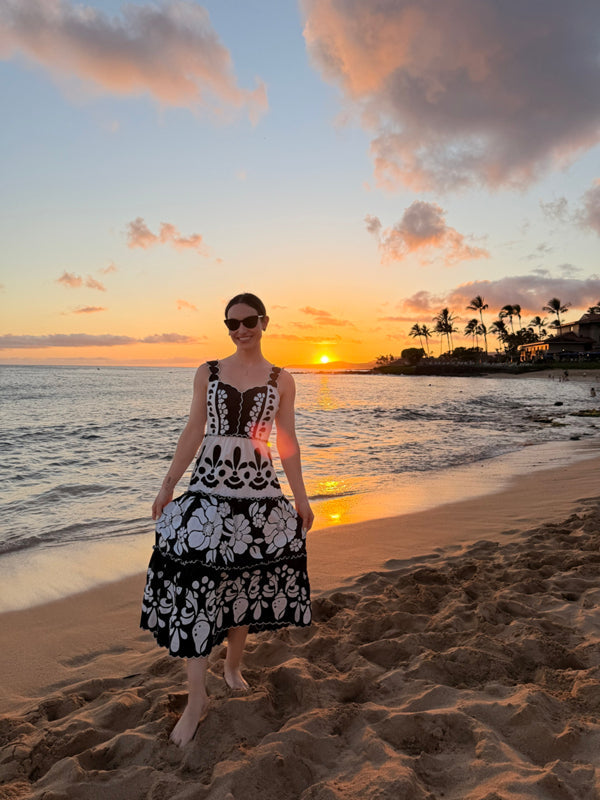 Black-and-white floral tiered midi dress, sleeveless with layered ruffles at hem