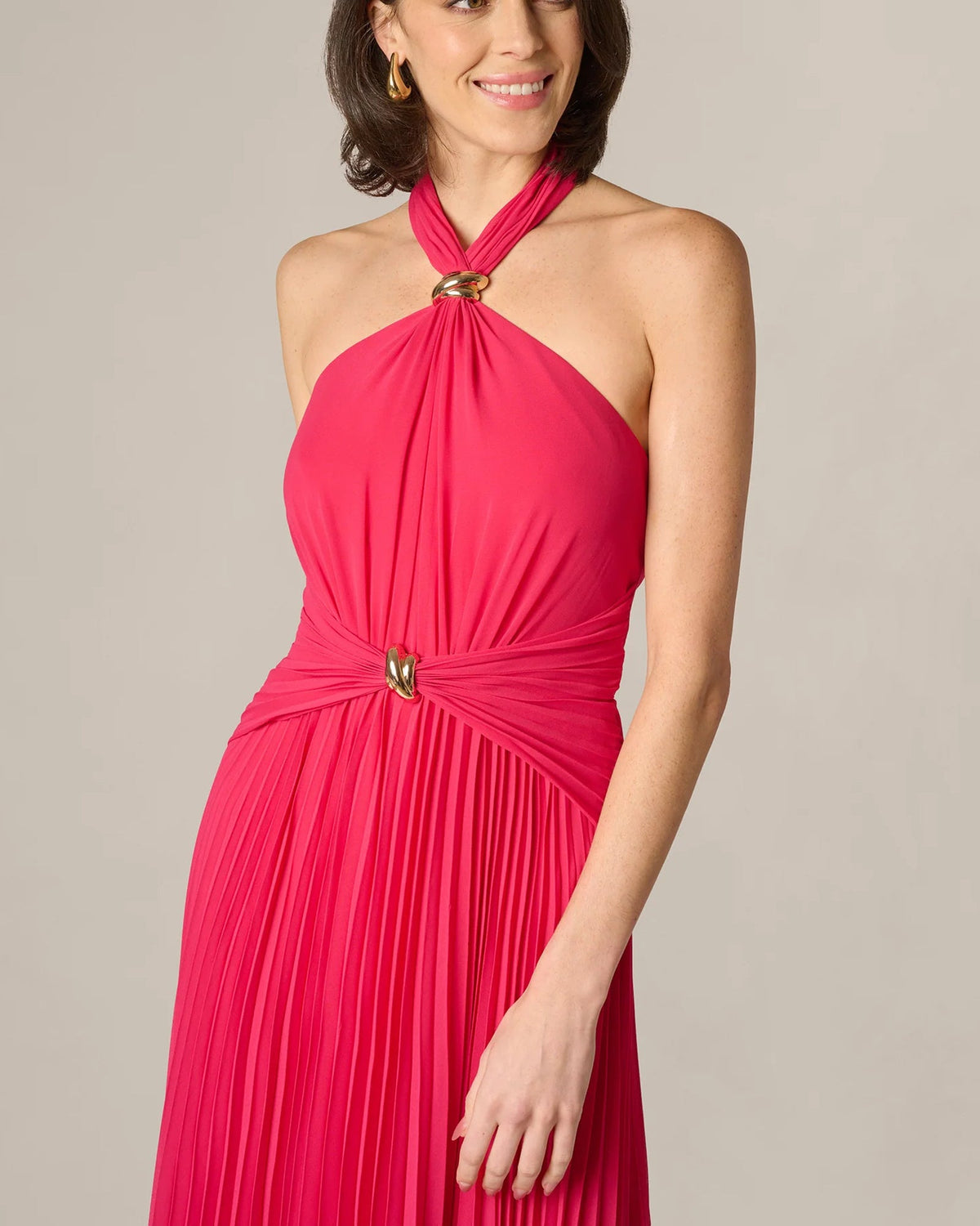 Cherry red halter neck dress with twisted knot bodice and pleated skirt